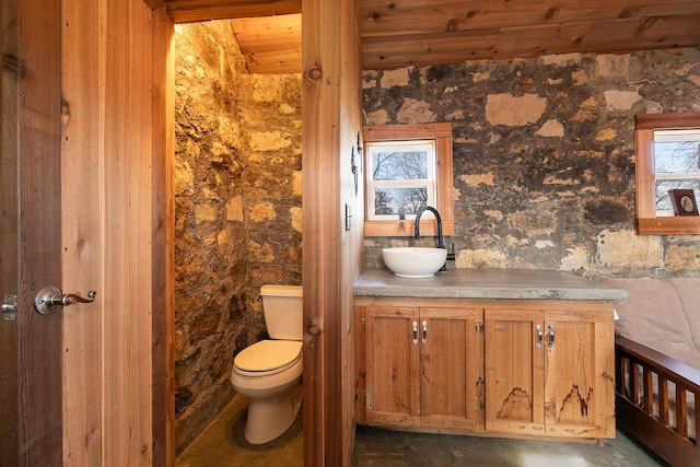 bathroom with vanity, wood ceiling, and toilet