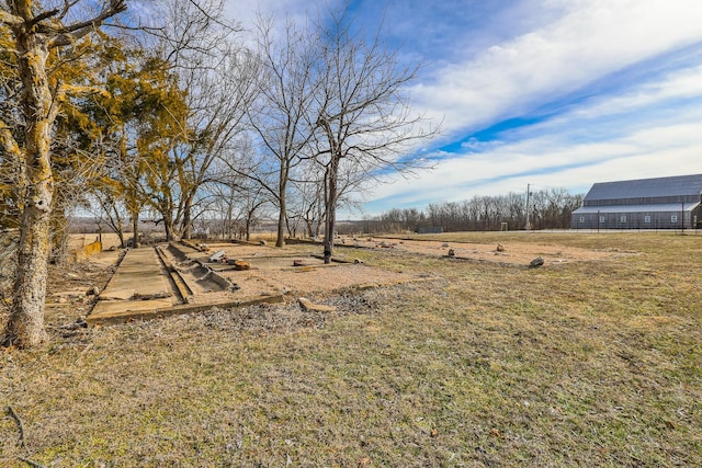 view of yard with a rural view