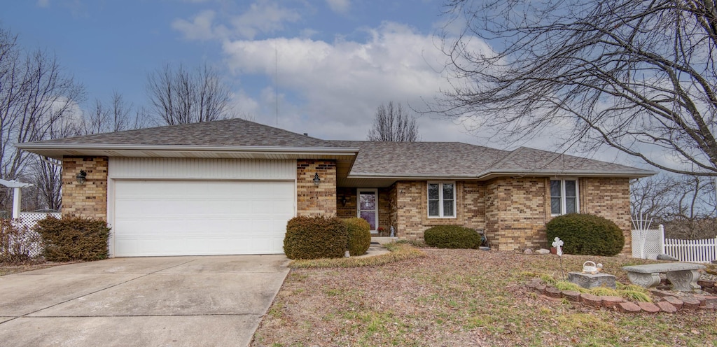 ranch-style home with a garage