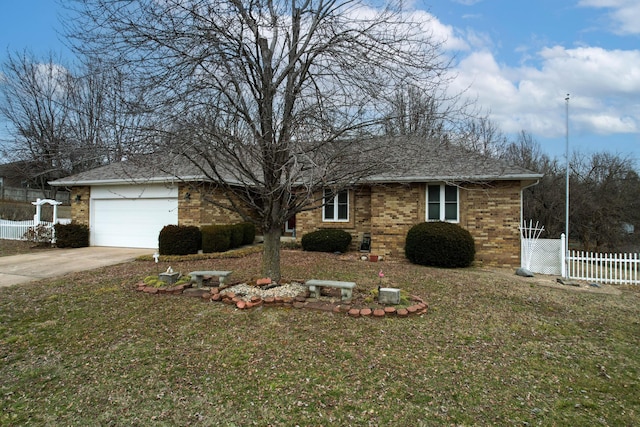 ranch-style home featuring a garage and a front lawn