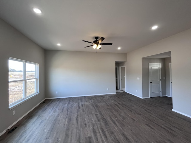 spare room featuring ceiling fan and dark hardwood / wood-style flooring