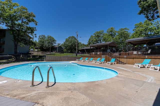 view of pool featuring a gazebo and a patio area