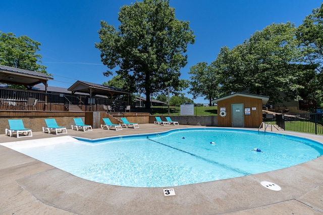 view of swimming pool featuring a gazebo and a patio