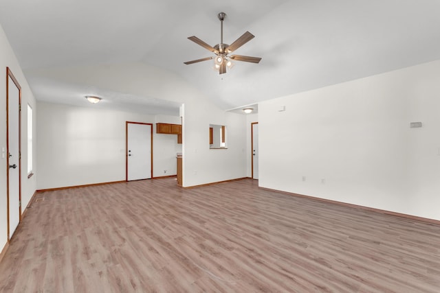 unfurnished room featuring light hardwood / wood-style flooring, high vaulted ceiling, and ceiling fan