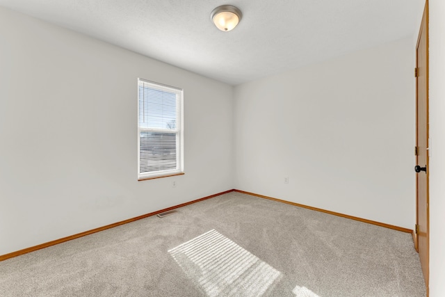 spare room featuring carpet flooring