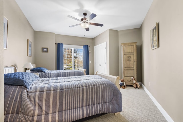 bedroom featuring ceiling fan and carpet flooring