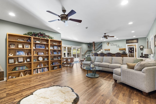 living area with hardwood / wood-style floors, stairway, recessed lighting, and a ceiling fan