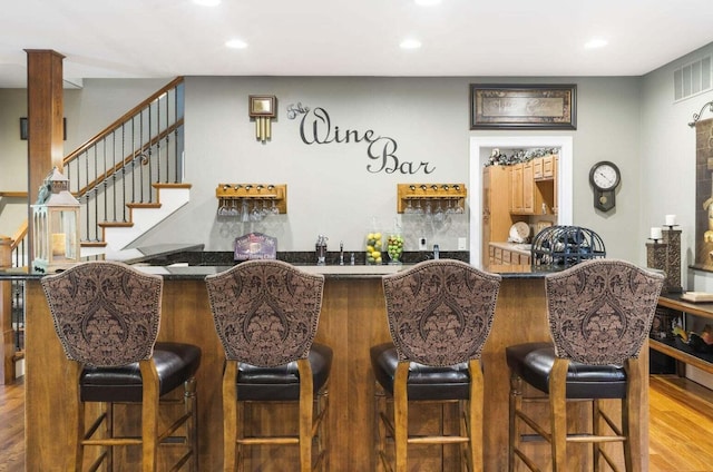 bar featuring hardwood / wood-style floors