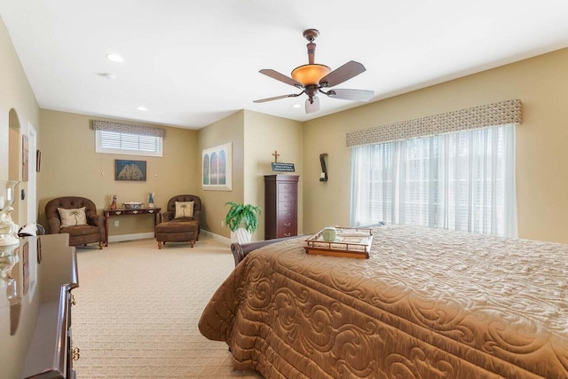 bedroom with a ceiling fan, recessed lighting, arched walkways, carpet, and baseboards