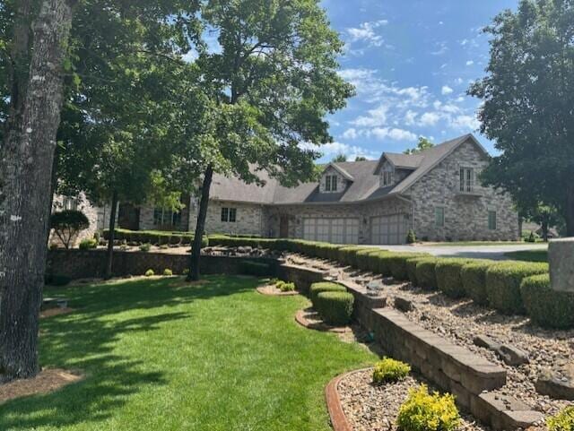 119 Silver Oak Way, Branson West, MO 65737 - view of grassy yard with an attached garage