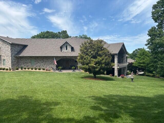 119 Silver Oak Way, Branson West, MO 65737 - view of front of house featuring a front lawn and stone siding