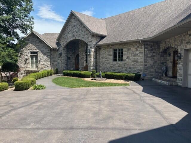 119 Silver Oak Way, Branson West, MO 65737 - view of front of home featuring stone siding and roof with shingles