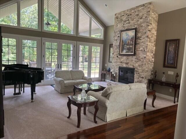 119 Silver Oak Way, Branson West, MO 65737 - living area with french doors, a fireplace, high vaulted ceiling, and wood finished floors