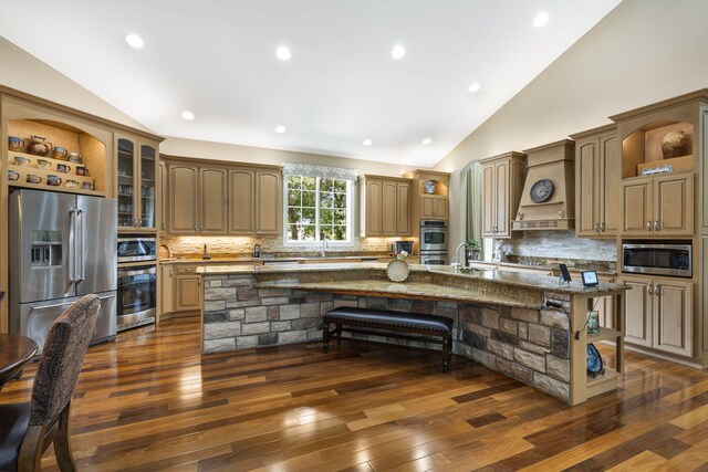 119 Silver Oak Way, Branson West, MO 65737 - kitchen featuring stainless steel appliances, open shelves, lofted ceiling, custom exhaust hood, and a breakfast bar area