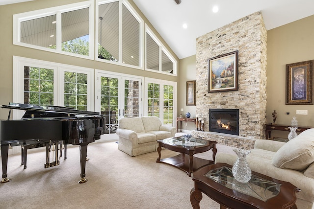 119 Silver Oak Way, Branson West, MO 65737 - living room with high vaulted ceiling, a stone fireplace, and carpet flooring