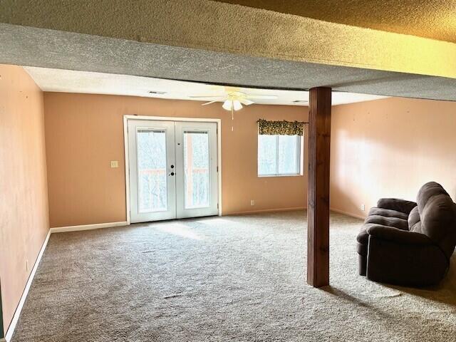 160 Old Glory Rd, Branson, MO 65616 - living room featuring french doors, ceiling fan, carpet flooring, and a textured ceiling