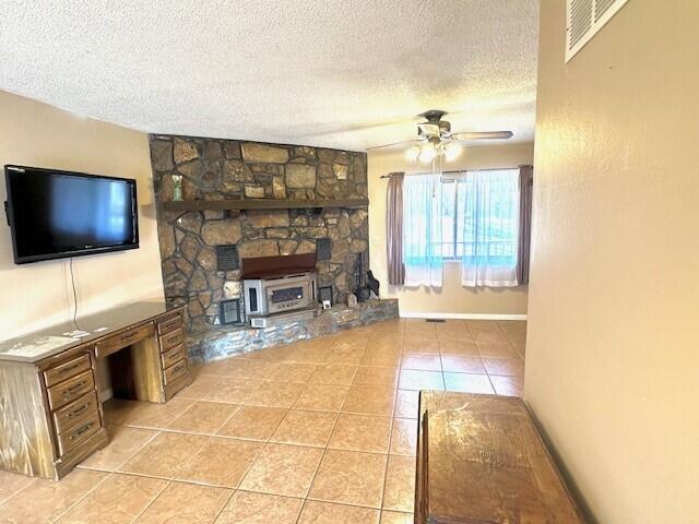 160 Old Glory Rd, Branson, MO 65616 - tiled living room featuring ceiling fan and a textured ceiling