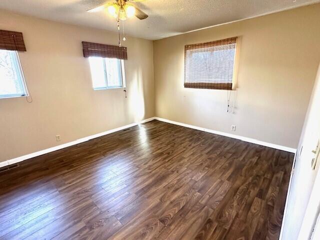 160 Old Glory Rd, Branson, MO 65616 - unfurnished room with ceiling fan, dark wood-type flooring, and a textured ceiling