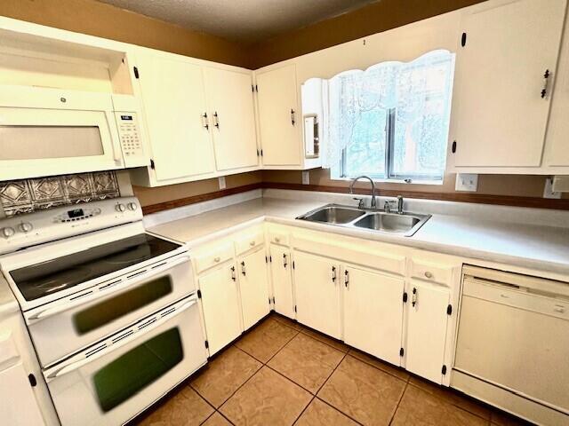 160 Old Glory Rd, Branson, MO 65616 - kitchen with white cabinetry, sink, white appliances, and light tile patterned floors