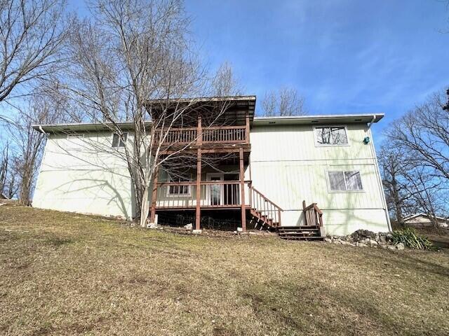 160 Old Glory Rd, Branson, MO 65616 - back of house with a deck and a lawn