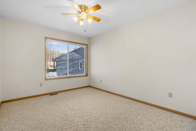 unfurnished room featuring carpet floors and ceiling fan