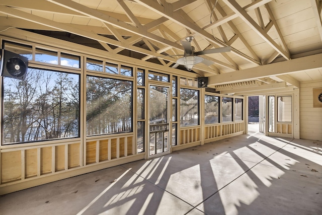 unfurnished sunroom with lofted ceiling and ceiling fan