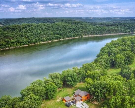 drone / aerial view with a water view