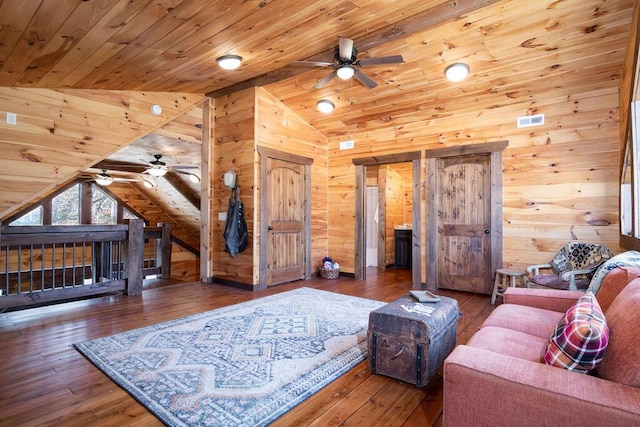 living room with wood ceiling, wood walls, lofted ceiling, and hardwood / wood-style flooring