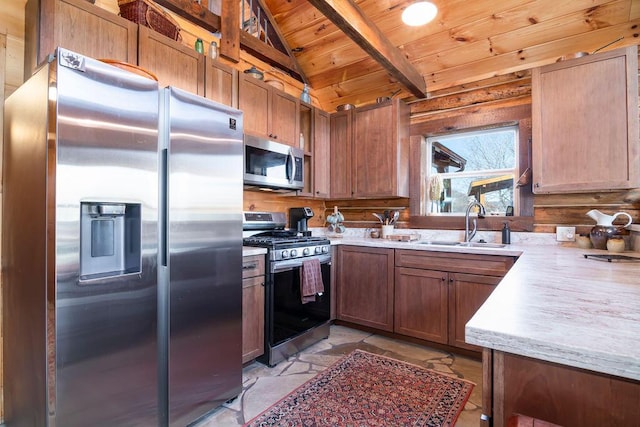 kitchen featuring sink, wood ceiling, lofted ceiling with beams, and appliances with stainless steel finishes