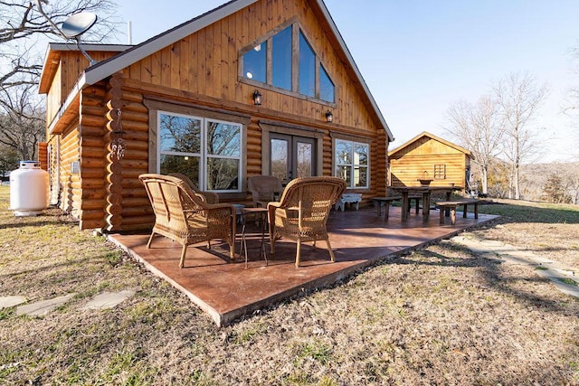 back of house featuring a patio and french doors