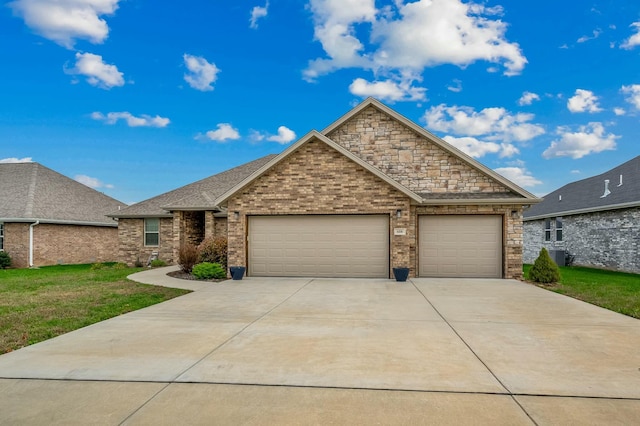 view of front of house with cooling unit, a garage, and a front lawn