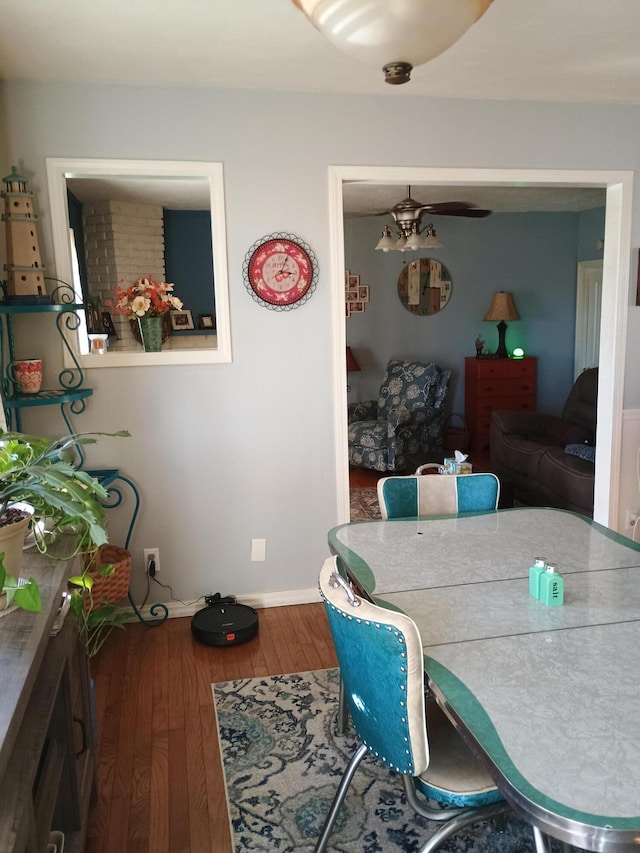 dining room with hardwood / wood-style flooring and ceiling fan