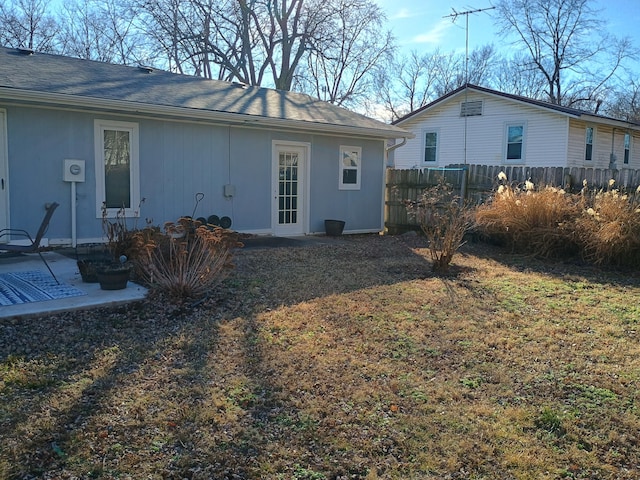 rear view of house with a lawn