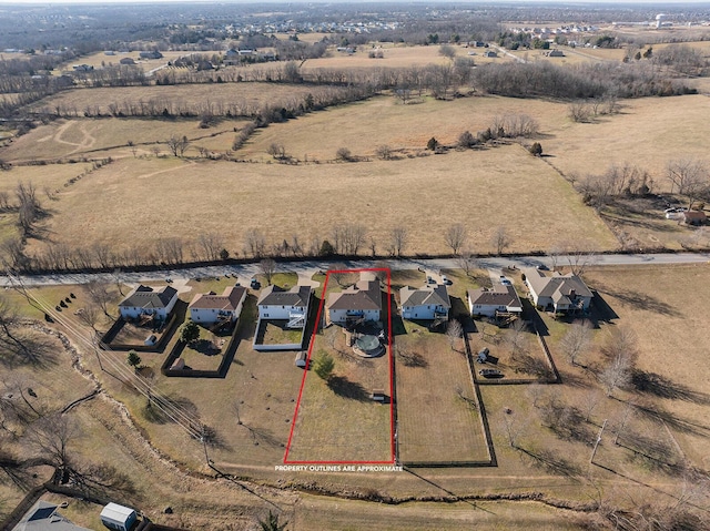 birds eye view of property featuring a rural view