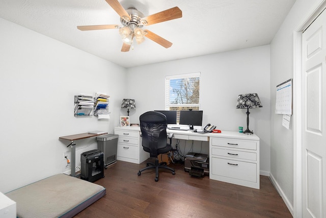 office space with dark wood-type flooring and ceiling fan