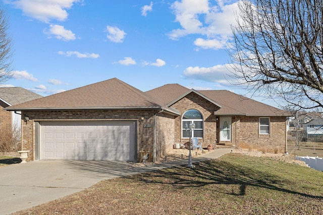 view of front facade with a garage and a front yard