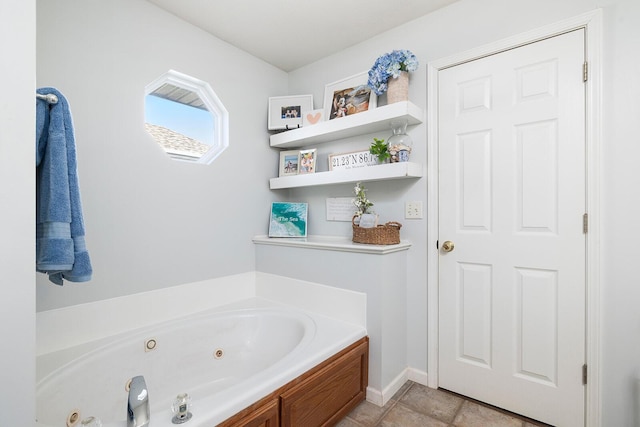 bathroom featuring tile patterned floors and a tub