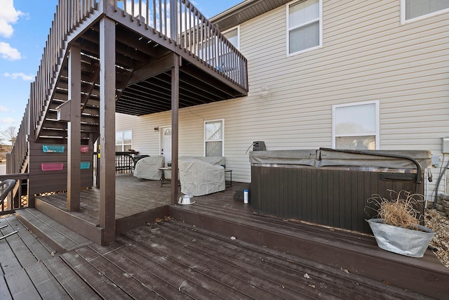 wooden deck with a hot tub