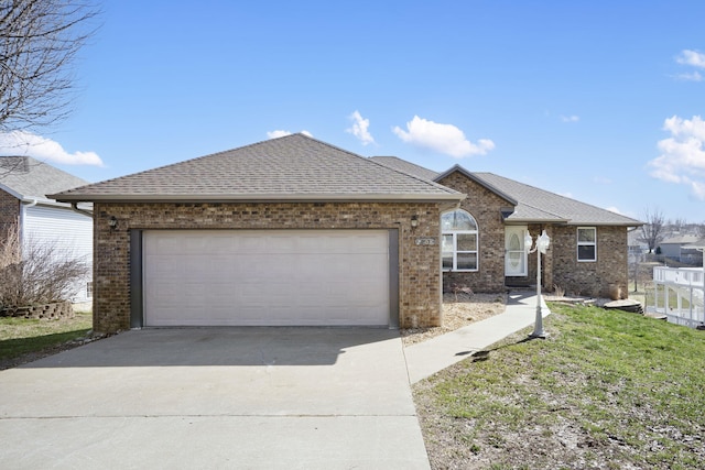 ranch-style home featuring an attached garage, brick siding, driveway, and a shingled roof