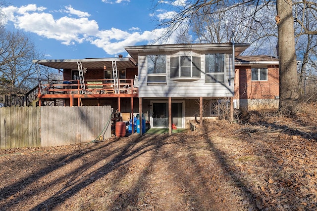 back of house with a wooden deck