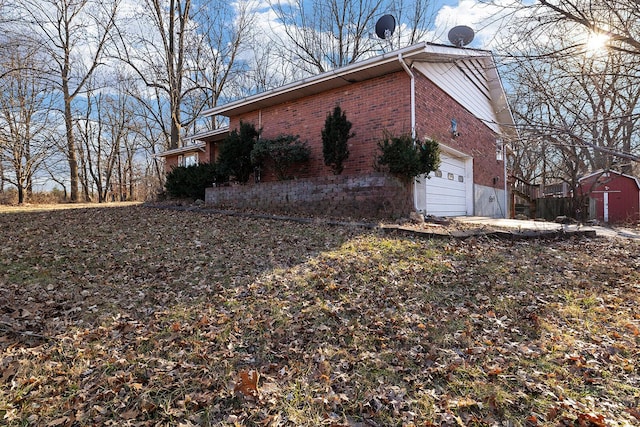 view of side of property with a garage