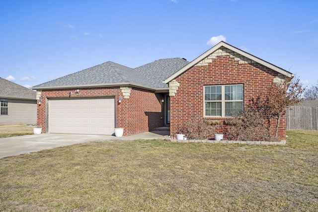 view of front of property with a garage and a front yard