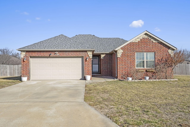 view of front of home featuring a garage and a front yard