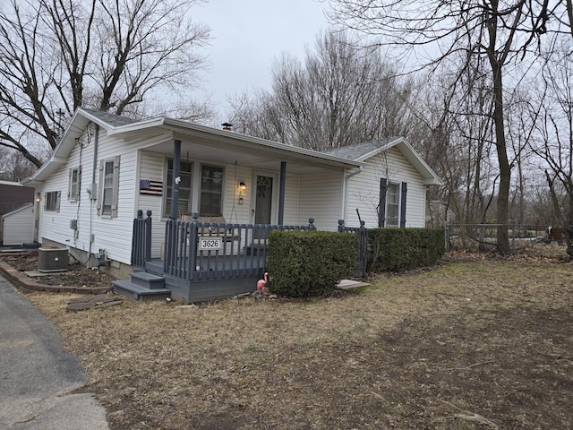 view of front facade featuring central AC unit and a porch