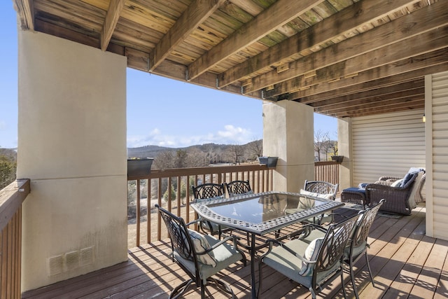 wooden terrace with a mountain view