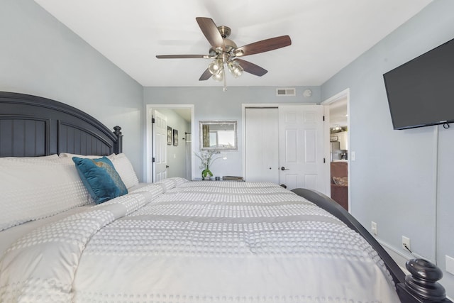 bedroom with ceiling fan and a closet