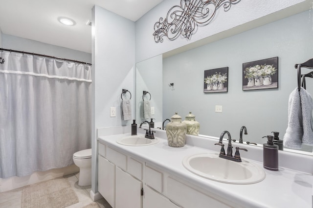 bathroom with vanity, tile patterned floors, toilet, and a shower with shower curtain