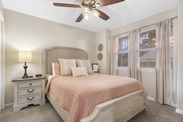 bedroom with ceiling fan and light colored carpet