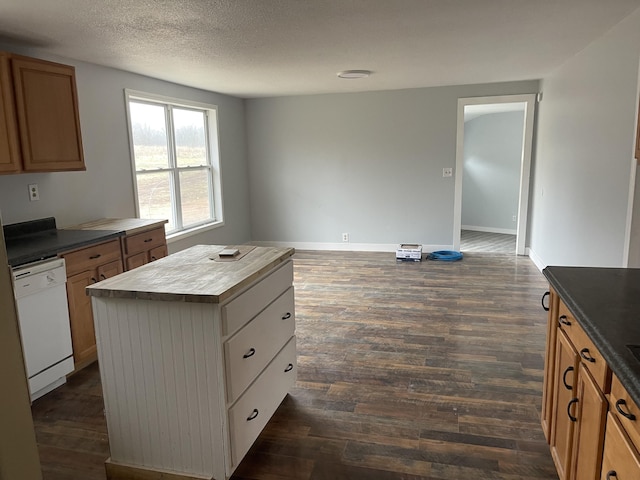 kitchen featuring a kitchen island, butcher block countertops, dark hardwood / wood-style flooring, white dishwasher, and a textured ceiling