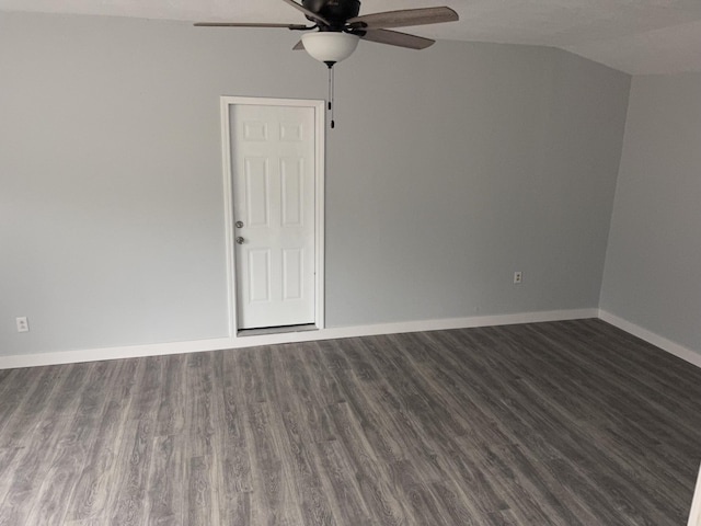 unfurnished room with vaulted ceiling, ceiling fan, and dark hardwood / wood-style flooring